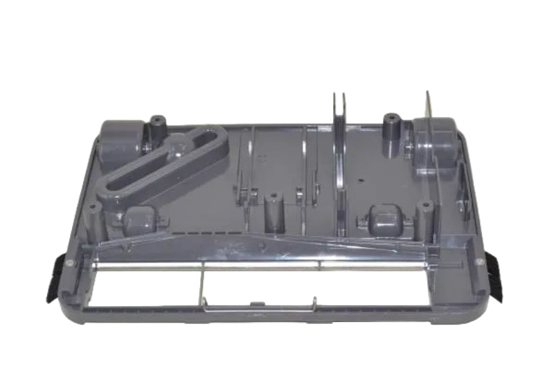 A gray plastic replacement part, likely a dishwasher or appliance component, shown from a top-down view on a light beige background.
