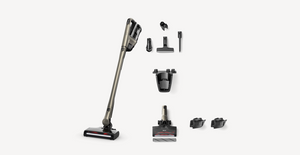 A cordless stick vacuum cleaner shown with multiple attachments and accessories arranged neatly on a light gray background.