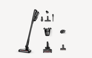 A cordless stick vacuum cleaner shown with multiple attachments and accessories arranged on a light gray background.